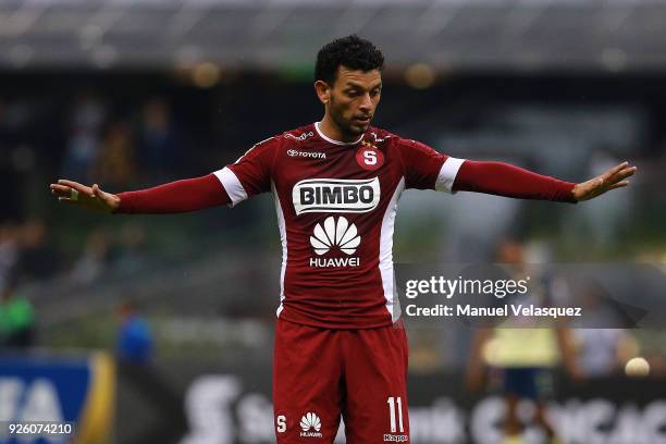 Michael Barrantes of Saprissa gestures during the match between America and Saprissa as part of the round of 16th of the CONCACAF Champions League at...