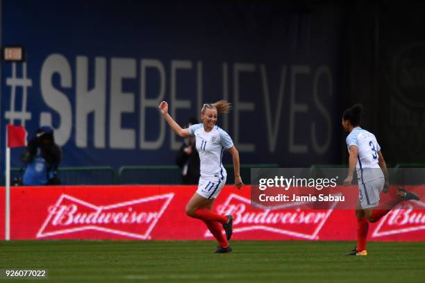 Toni Duggan of England celebrates her opening goal against France in the first half with Demi Stokes of England on March 1, 2018 at MAPFRE Stadium in...