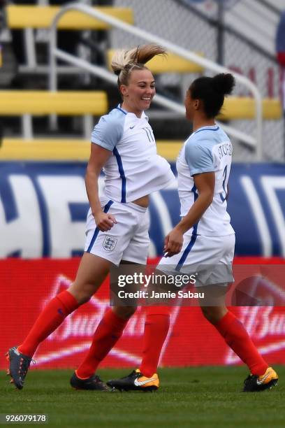 Toni Duggan of England celebrates her opening goal against France in the first half with Demi Stokes of England on March 1, 2018 at MAPFRE Stadium in...