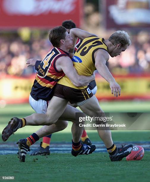 Lance Picioane for Hawthorn is tackled by Ben Hart from Adelaide during the round six AFL match between the Hawthorn Hawks and the Adelaide Crows,...