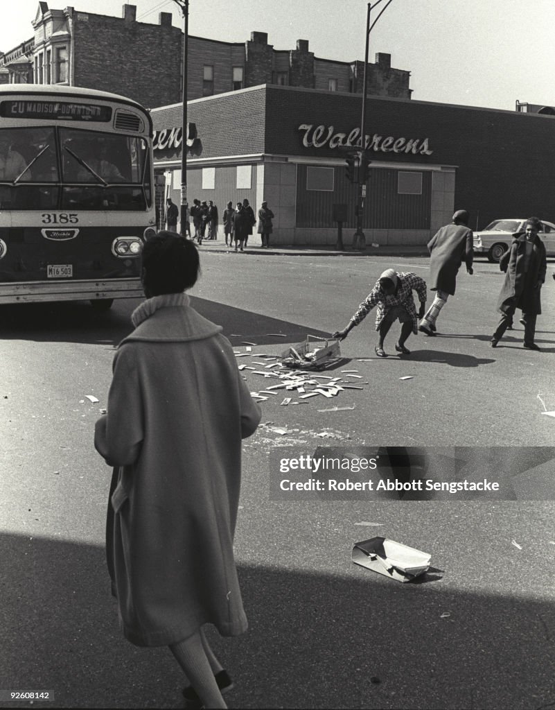 Chicago Riots 1968 Book Following looting in the area, pedestrians drag debris from the... News ...