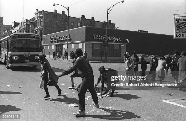 Chicago Riots 1968 Book Following looting in the area, pedestrians drag debris from the... News ...