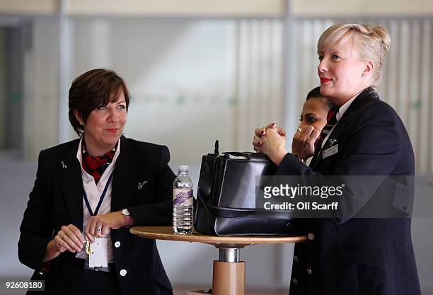 Union members of British Airways Cabin Crew wait to conduct a meeting at Sandown Park Racecourse to discuss a postal ballot on whether to strike at...
