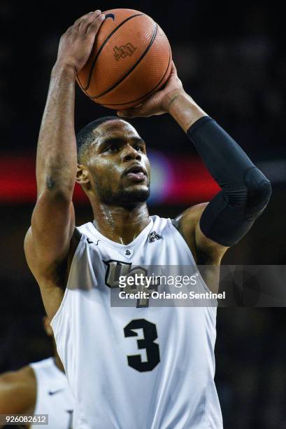 Forward A.J. Davis shoots a free throw against Cincinnati in a January 2018 file photo, at CFE Arena in Orlando, Fla., where the Knights played host...