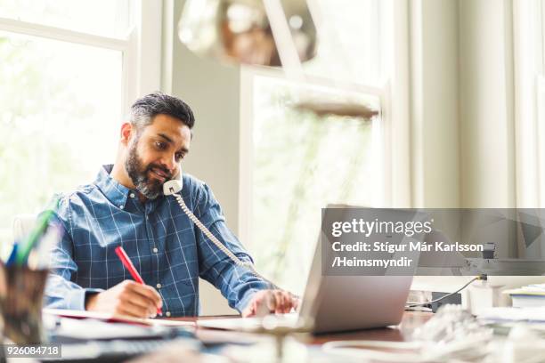 businessman working in home office - multitasking man stock pictures, royalty-free photos & images