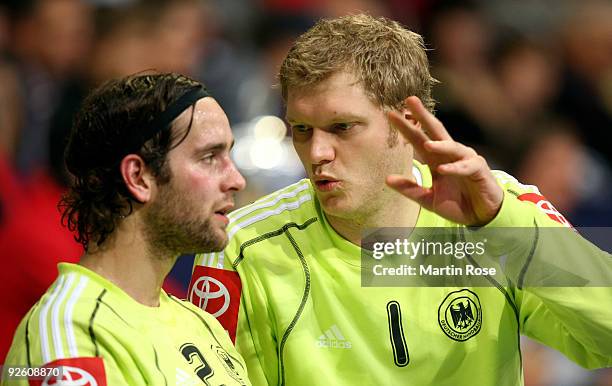 Johannes Bitter , goalkeeper of Germany talks to Silvio Heinevetter during the Supercup 2009 game between Germany and Denmark at the TUI Arena on...