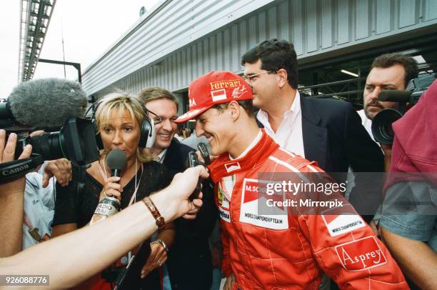 Michael Schumacher talking to the press at Silverstone, 13th July 1996.