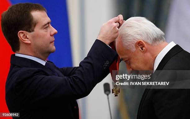 Russian President Dmitry Medvedev awards famous Russian conductor and violinist Vladimir Spivakov the order "Service to the Fatherland" 2nd degree at...