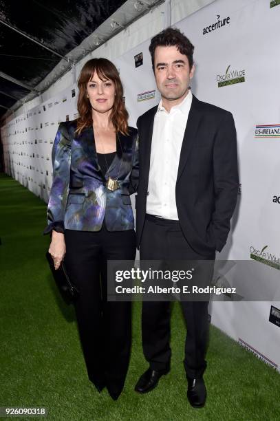 Rosemarie DeWitt and Ron Livingston attend the Oscar Wilde Awards 2018 at Bad Robot on March 1, 2018 in Santa Monica, California.