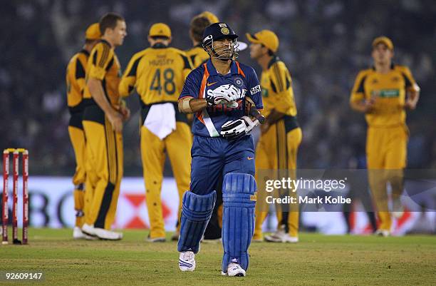 Sachin Tendulkar of India leaves the field after his dismissal during the fourth One Day International match between India and Australia at Punjab...