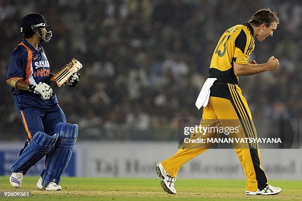 Australian cricketer Nathan Hauritz reacts after taking the wicket of India's Sachin Tendulkar during the fourth One-Day International between India...