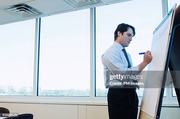 businessman preparing presentation - writing flip chart stock pictures, royalty-free photos & images