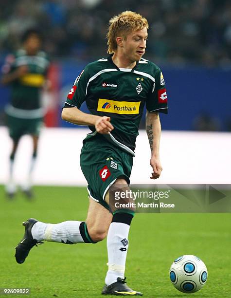 Marco Reus of Gladbach runs with the ball during the Bundesliga match between Hamburger SV and Borussia M'gladbach at the HSH Nordbank Arena on...