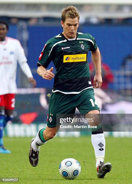 Thorben Marx of Gladbach runs with the ball during the Bundesliga match between Hamburger SV and Borussia M'gladbach at the HSH Nordbank Arena on...