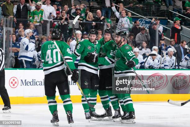 Remi Elie, Jason Dickinson, Brett Ritchie and Greg Pateryn of the Dallas Stars celebrate a goal against the Tampa Bay Lightning at the American...