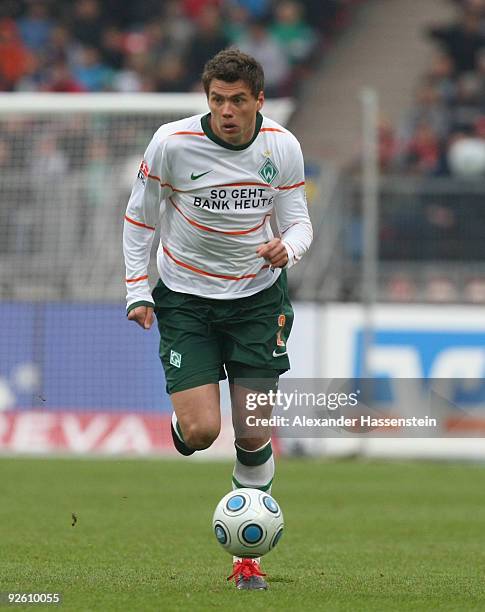 Sebastian Boenisch of Bremen runs with the ball during the Bundesliga match between 1.FC Nuernberg and Werder Bremen at Easy Credit Stadium on...