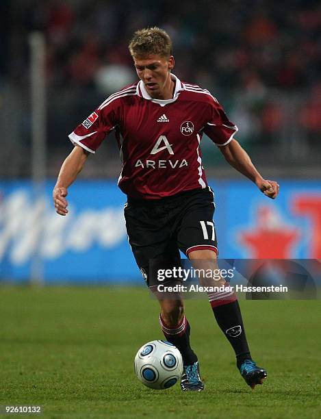 Mike Frantz of Nuernberg runs with the ball during the Bundesliga match between 1.FC Nuernberg and Werder Bremen at Easy Credit Stadium on October...