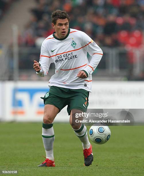 Sebastian Boenisch of Bremen runs with the ball during the Bundesliga match between 1.FC Nuernberg and Werder Bremen at Easy Credit Stadium on...