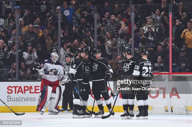 Jake Muzzin, Alex Iafallo, Christian Folin, Anze Kopitar, and Dustin Brown of the Los Angeles Kings celebrate after scoring a goal against the...