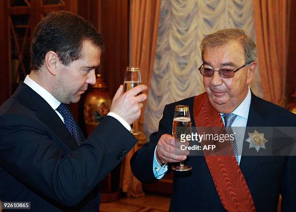 Russian President Dmitry Medvedev toasts with former prime minister Yevgeny Primakov in Moscow on October 29, 2009 to celebrate Primakov's 80th...
