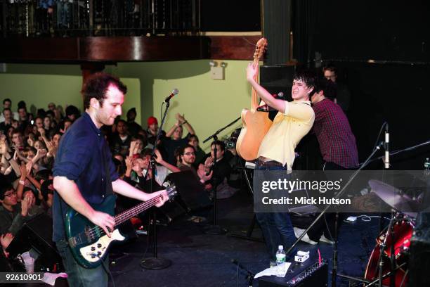 View from the back of the stage showing Chris Baio and Ezra Koenig of Vampire Weekend performing in front of a cheering audience at The Bowery...