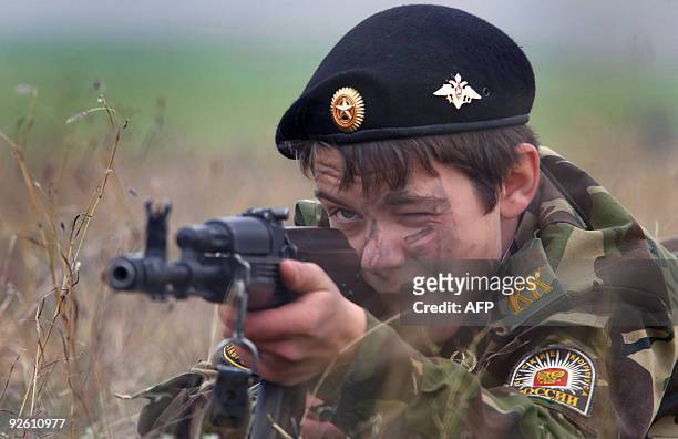 Cadet of a Stavropol Cadet School takes aim during a training camp on October 31, 2009 in a field not far from the village ov Krasnogvardeiskoye,...