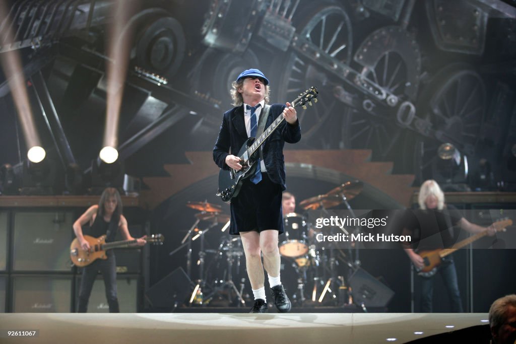 Malcolm Young, Angus Young and Cliff Williams of AC/DC perform on ...