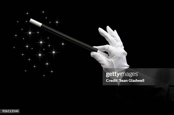 magic wand - mago fotografías e imágenes de stock