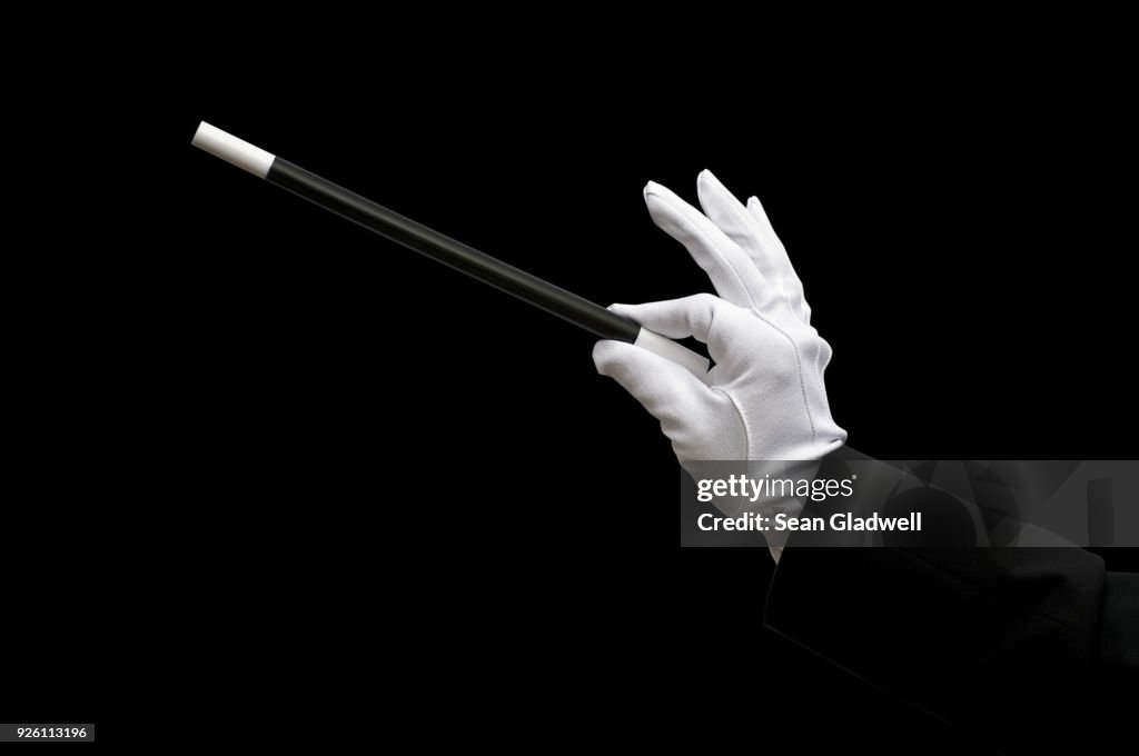 Magician holding magic wand