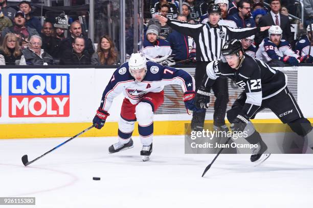 Dustin Brown of the Los Angeles Kings battles for the puck against Jack Johnson of the Columbus Blue Jackets at STAPLES Center on March 1, 2018 in...