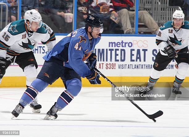 Rich Peverley of the Atlanta Thrashers carries the puck against the San Jose Sharks at Philips Arena on October 24, 2009 in Atlanta, Georgia.