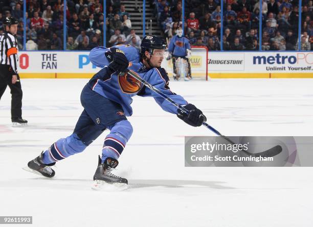 Ron Hainsey of the Atlanta Thrashers fires a shot against the San Jose Sharks at Philips Arena on October 24, 2009 in Atlanta, Georgia.