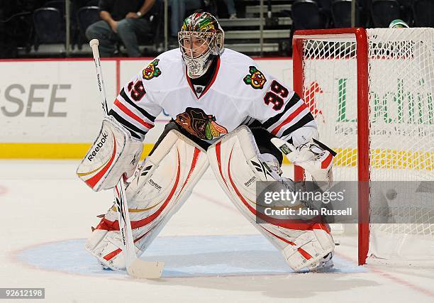 Cristobal Huet of the Chicago Blackhawks eyes the play along the boards against the Nashville Predators on October 29, 2009 at the Sommet Center in...