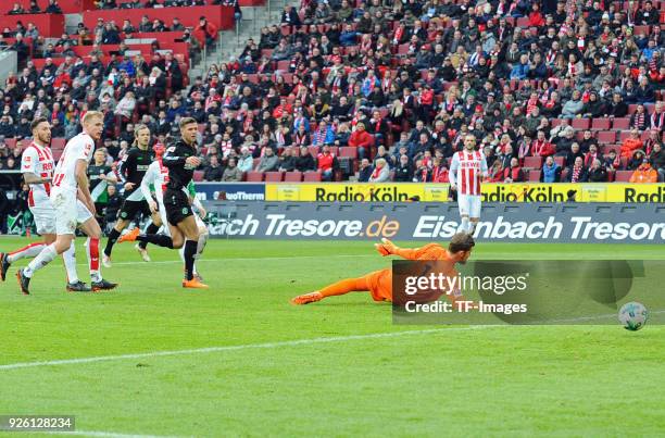 Niclas Fuellkrug of Hannover scores the team`s first goal during the Bundesliga match between 1. FC Koeln and Hannover 96 at RheinEnergieStadion on...