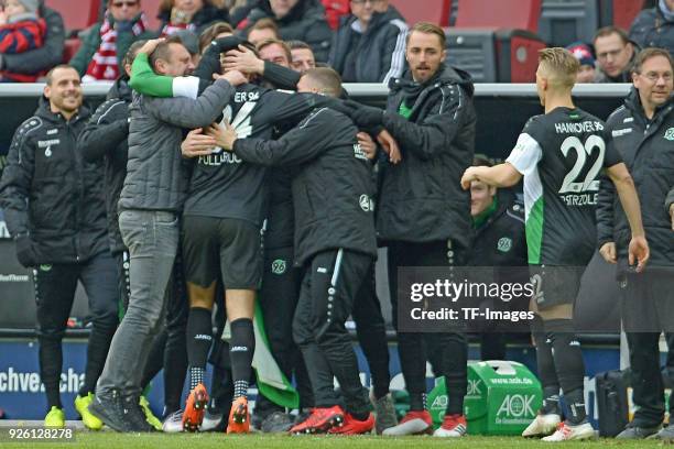 Niclas Fuellkrug of Hannover celebrates after scoring his team`s first goal with team mates during the Bundesliga match between 1. FC Koeln and...