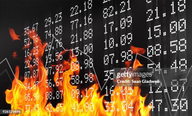 stock exchange numbers and flames - stock market crash stock-fotos und bilder