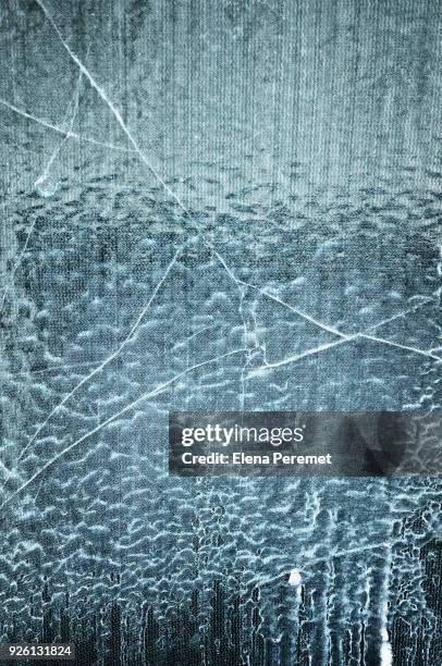 cracks of ice on glass - breaking the ice stock-fotos und bilder