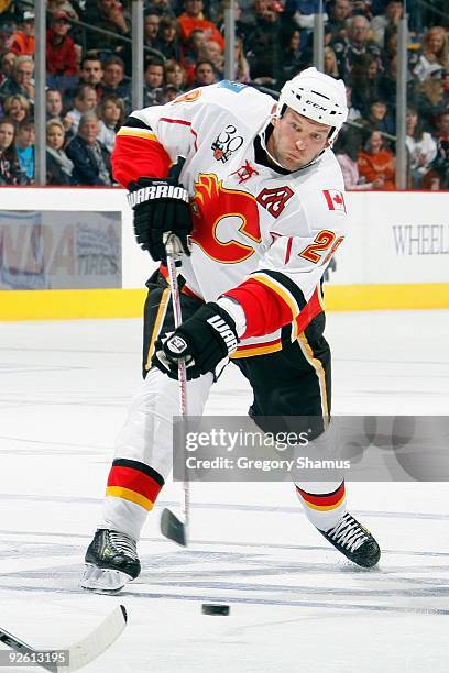 Robyn Regehr of the Calgary Flames shoots the puck during the game against the Columbus Blue Jackets on October 13, 2009 at Nationwide Arena in...