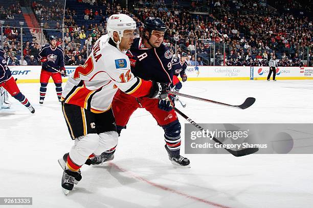 Jarome Iginla of the Calgary Flames skates against Rostislav Klesla of the Columbus Blue Jackets during the game on October 13, 2009 at Nationwide...