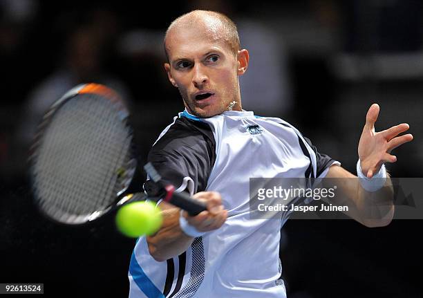 Nikolay Davydenko of Russia returns a backhand in his first round match against Alejandro Falla of Colombia during the ATP 500 World Tour Valencia...