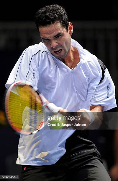 Alejandro Falla of Colombia plays a double handed backhand in his first round match against Nikolay Davydenko of Russia during the ATP 500 World Tour...