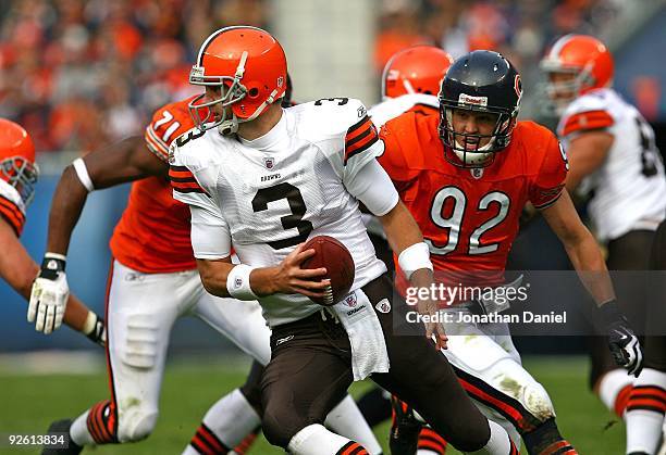 Derek Anderson of the Cleveland Browns runs away from Hunter Hillenmeyer of the Chicago Bears at Soldier Field on November 1, 2009 in Chicago,...