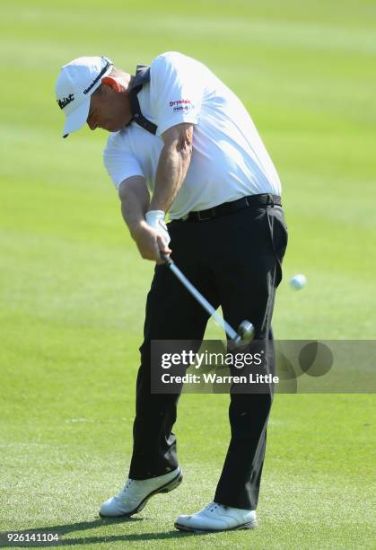 David Drysdale of Scotland plays his second shot into the 12th green during the second round of the Tshwane Open at Pretoria Country Club on March 2,...