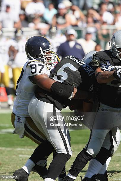 Linebacker Calvin Pace of the New York Jets has a sack of Quarterback Bruce Gradkowski of the Oakland Raiders at Oakland-Alameda County Coliseum on...