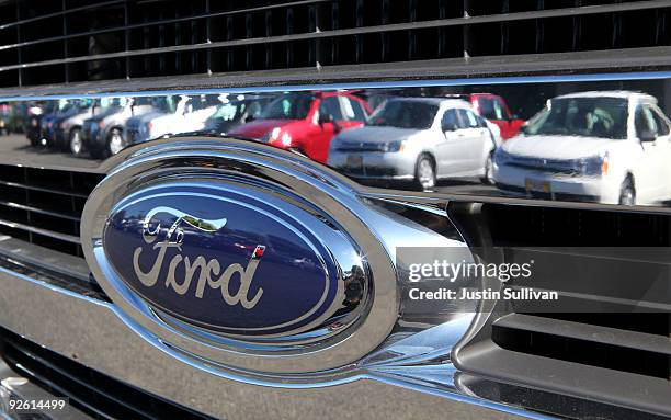 Cars are reflected in the grill of a new Ford truck November 2, 2009 in Richmond, California. Ford Motor rerported a nearly $1 billion third quarter...