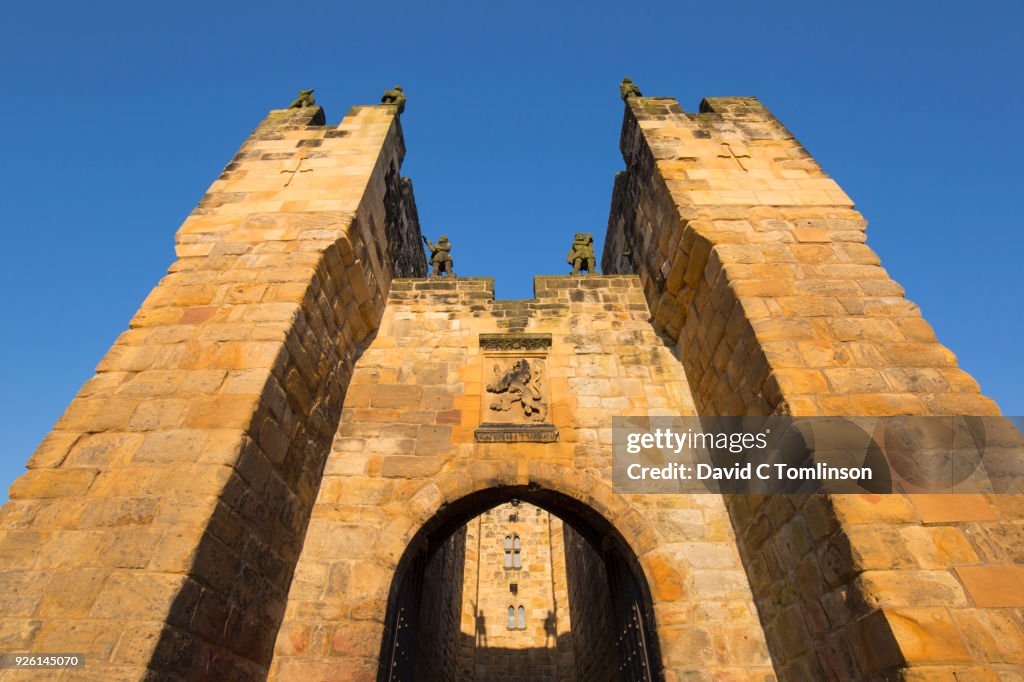 The Barbican and Gatehouse of Alnwick Castle, sunset, Alnwick, Northumberland, England, UK