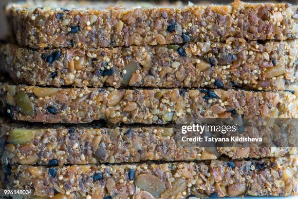 flour-less, gluten free, vegan, grain free homemade bread with seeds and nuts - flax seed fotografías e imágenes de stock