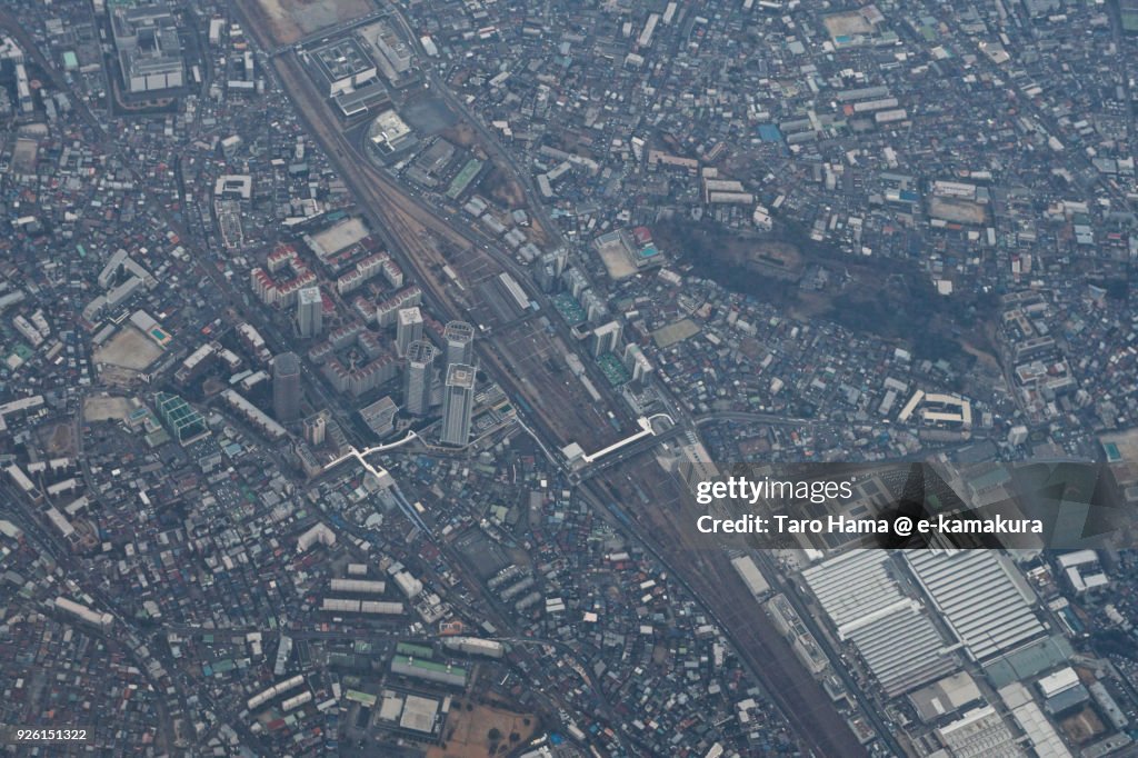 JR Shinkawasaki station in Kawasaki city in Kanagawa prefecture in Japan daytime aerial view from airplane