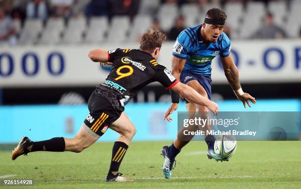 Augustine Pulu of the Blues chips the ball forward during the round two Super Rugby match between the Blues and the Chiefs at Eden Park on March 2,...