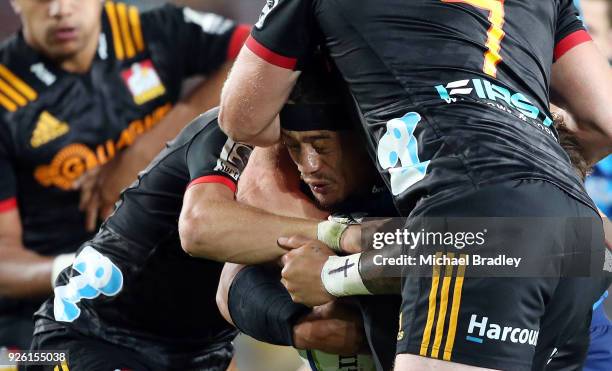 Augustine Pulu of the Blues is takled by the defence during the round two Super Rugby match between the Blues and the Chiefs at Eden Park on March 2,...